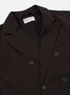 The Licorice Summer Canvas Manor Jacket is shown from the back as a flat lay against a plain white background. The jacket features a clean rear panel with a straight hem and relaxed shoulders, characteristic of its casual suiting style. The dark brown canvas fabric is highlighted, showing a soft, suede-like texture.