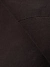 A close-up fabric swatch of the Licorice Summer Canvas Manor Jacket highlights the deep brown color and the dense, textured weave of the summer canvas fabric. The material fills the frame, providing a detailed view of the garment's color and construction.