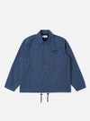 The Blue Sintra Recycled Cotton Head Coach Jacket is shown as a flat lay against a white background. The jacket features a relaxed, boxy fit with a two-way zip front, a classic pointed collar, and two large front patch pockets with button flaps. The blue fabric is a recycled cotton and polyester blend with a smooth, durable finish.
