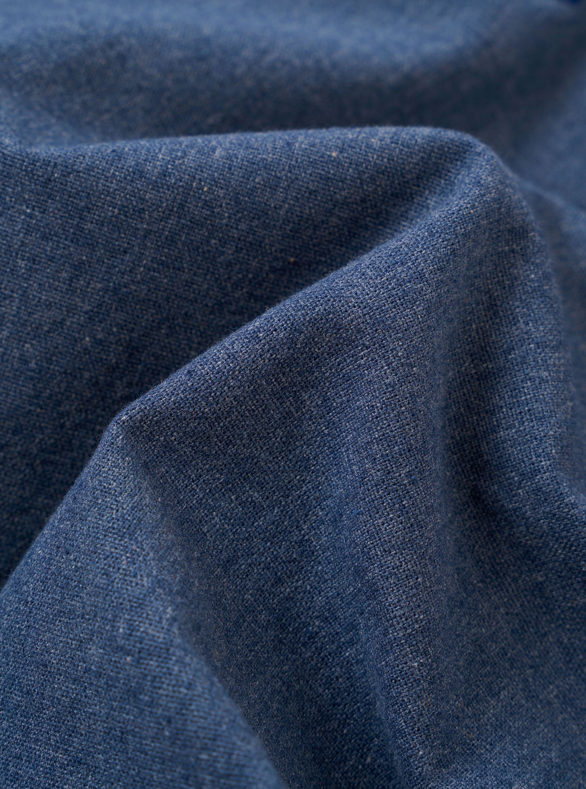 A close-up fabric swatch of the Blue Sintra Recycled Cotton Head Coach Jacket highlights the deep blue color and the textured weave of the recycled cotton material.