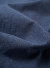 The Blue Sintra Recycled Cotton E130 Jacket is displayed as a flat lay against a plain white background. The jacket features a standard collar, a central button closure, and two large patch pockets at the waist. The fabric is a solid blue recycled cotton blend with a smooth texture.
