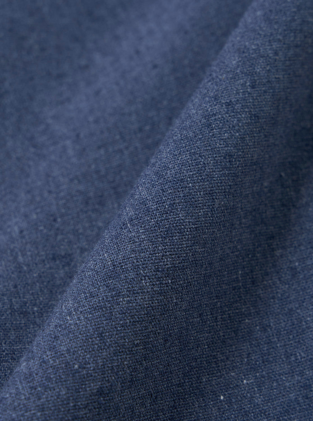 A close-up swatch image of the Blue Sintra Recycled Cotton Oxford Pant fabric. The image focuses on the blue cotton material, highlighting its fine weave texture and consistent color. The background is neutral.