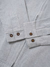 The Light Indigo Jean Cloth Reworked Rose Bowl Jacket is shown from the back as a flat lay against a plain white background. The jacket is constructed from light indigo organic cotton and features a clean, simple back panel with a straight hem and visible tonal stitching along the seams.