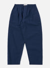 The Navy Derby Stripe Oxford Pant is shown as a flat lay against a plain white background. The trousers feature a vertical navy and white stripe pattern, a wide-leg fit, and double pleats at the waist. The design includes an elasticated waistband with an external drawstring and two side pockets.