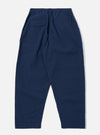 The Navy Derby Stripe Oxford Pant is shown from the back as a flat lay against a plain white background. The image highlights the two rear patch pockets, an elasticated waistband with a drawstring, and a subtle vertical stripe pattern on the navy cotton fabric.