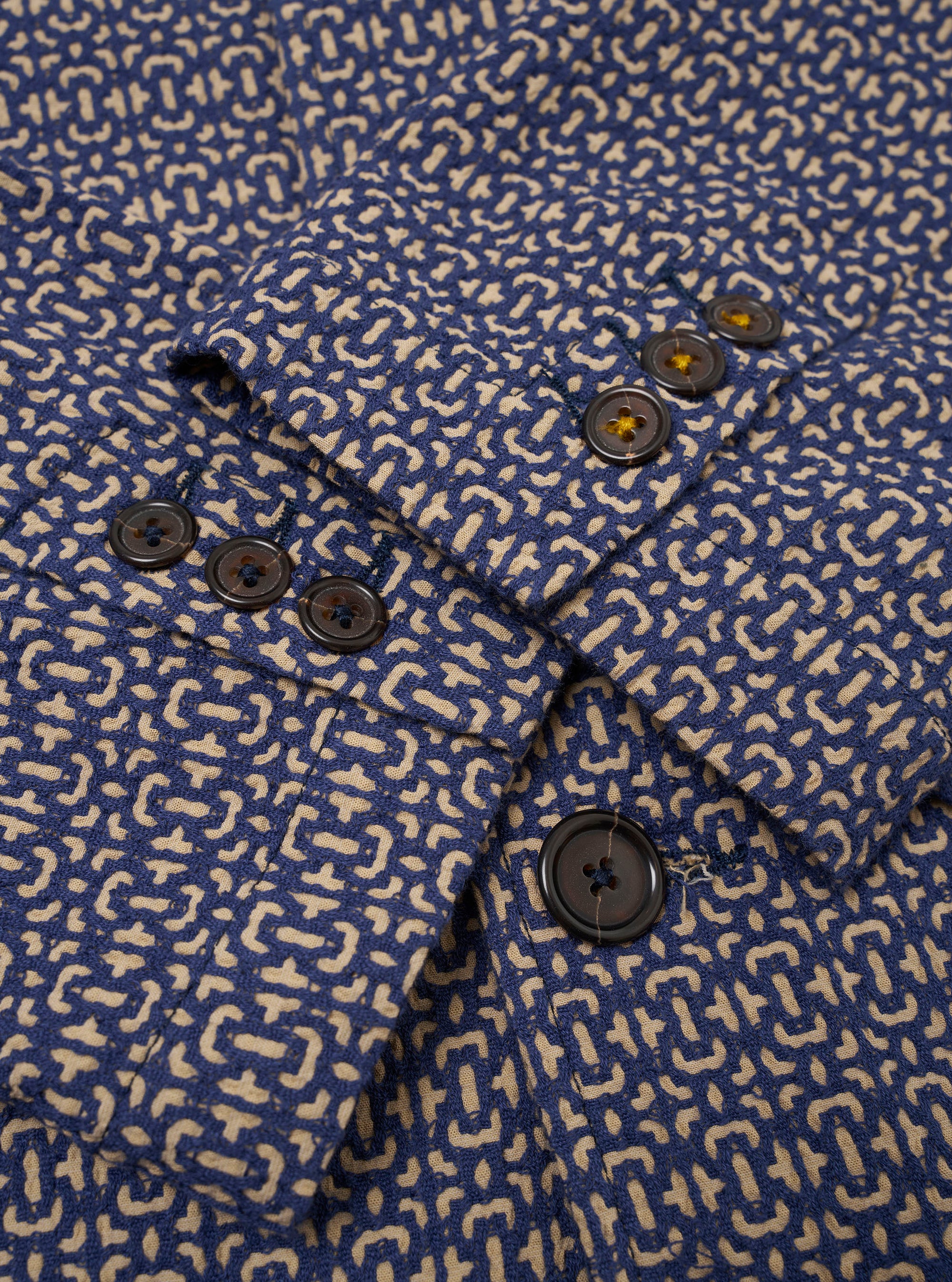 The Navy Konos Cotton Warmus Jacket is shown in a detail view as a flat lay against a plain white background. The image highlights the textured cotton fabric and the construction of the jacket's functional pockets, including a visible flap-down hip pocket.