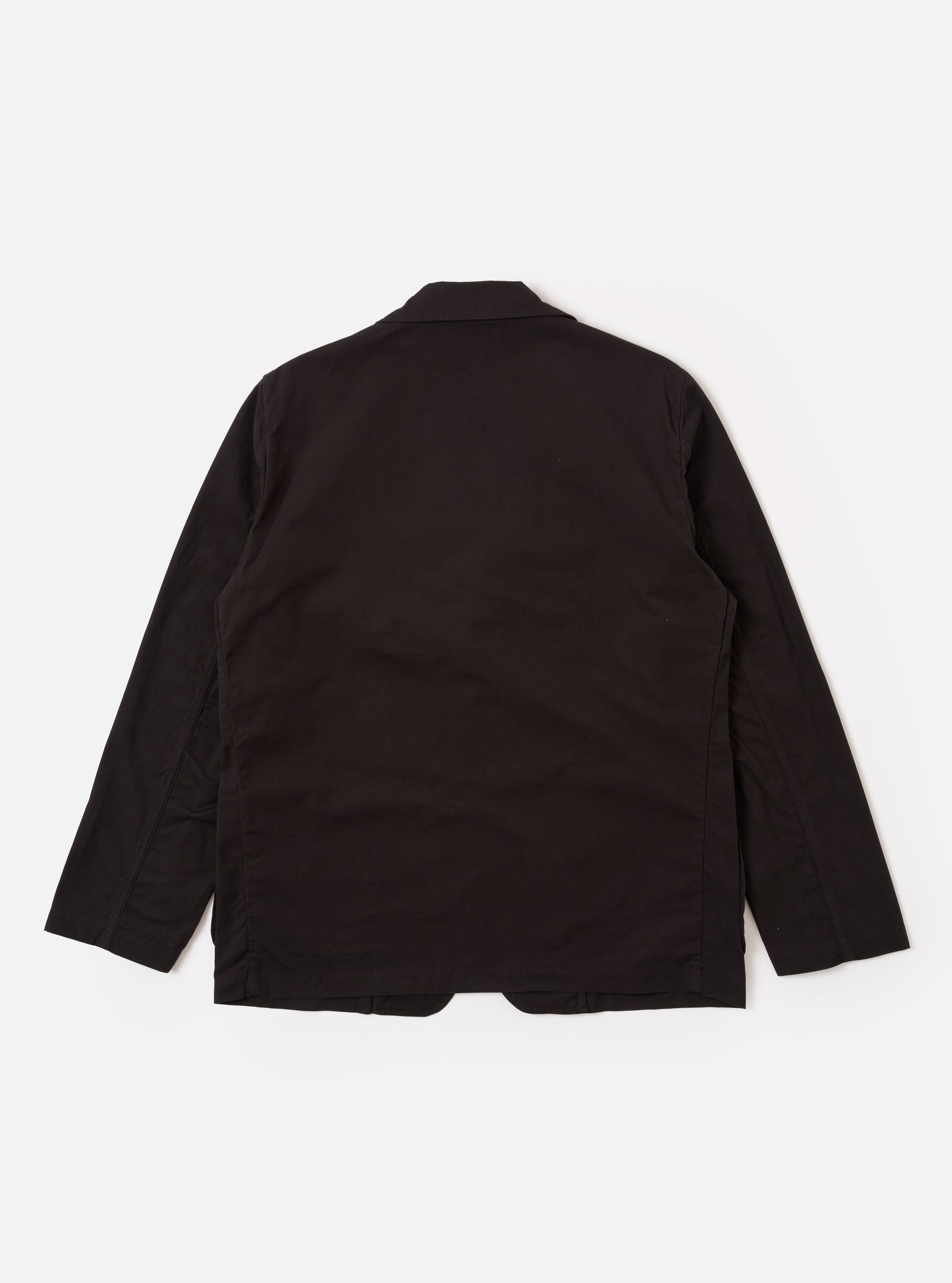 The Licorice Summer Canvas Two Button Jacket is shown as a flat lay against a white background. The jacket features a notched lapel, two-button front closure, a single welt chest pocket, and two large patch pockets at the waist. The fabric is a solid dark brown cotton canvas with a visible fine-grained texture.