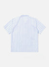 The Soft Blue Mc Stripe Road Trip Shirt is shown as a flat lay against a white background. The shirt features a camp collar, a full-length button-down front, and a straight hem. The fabric has a light blue and white striped pattern with intricate tropical foliage embroidery on the right side of the chest.
