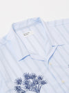 The Soft Blue Mc Stripe Road Trip Shirt is shown from the back as a flat lay against a white background. The image highlights the horizontal stripe pattern across the yoke and the vertical stripes on the main body of the shirt.