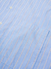 The Blue Mc Stripe Square Pocket Shirt is shown from the back as a flat lay against a plain white background. The image highlights the vertical blue and white stripe pattern across the main body and the horizontal stripe orientation on the rear yoke. The shirt features a straight hem and simple, clean construction.
