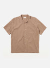 The Brown Sido Linen Mix Road Shirt is shown as a flat lay against a white background. The shirt features a one-piece loop-close collar, a full-length button-down front, and a single patch pocket on the left chest. The short-sleeved garment is made from a textured brown cotton-linen blend fabric and has a straight hem.