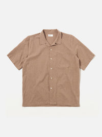 The Brown Sido Linen Mix Road Shirt is shown as a flat lay against a white background. The shirt features a one-piece loop-close collar, a full-length button-down front, and a single patch pocket on the left chest. The short-sleeved garment is made from a textured brown cotton-linen blend fabric and has a straight hem.