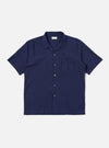 The Navy Arten Seersucker Road Shirt is shown as a flat lay against a white background. The short-sleeved shirt features a camp collar with a loop closure, a single chest patch pocket, and a straight hem. The dark navy fabric has a distinct puckered seersucker texture throughout.