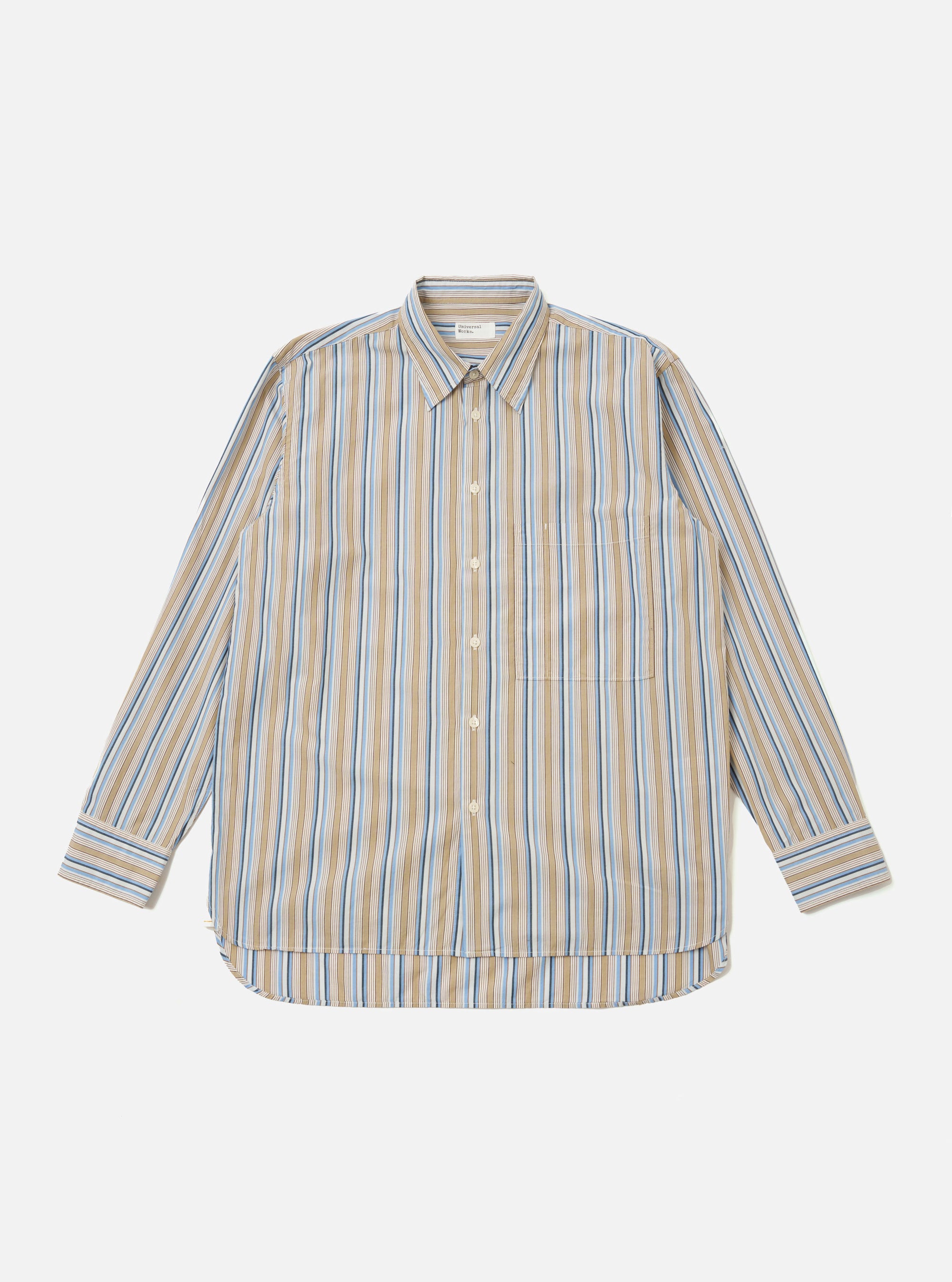 The Multi Pop Multi Stripe Square Pocket Shirt is shown as a flat lay against a white background. The shirt features a vibrant vertical multi-stripe pattern in various colors and includes a prominent square patch pocket on the left chest. It is designed with a classic button-down front and a structured collar.
