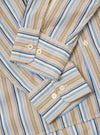 The Multi Pop Multi Stripe Square Pocket Shirt is shown from the back as a flat lay against a plain white background. The image highlights the horizontal stripe pattern on the back yoke, which contrasts with the vertical stripes on the main body of the shirt. The curved hem and long sleeves are clearly visible.