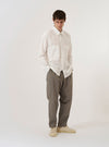 The Ecru Organic Fine Poplin CPO Shirt is shown as a flat lay against a plain white background. The shirt features a relaxed fit with a two-piece collar, a central button-down front, and two large buttoned patch pockets at the chest. The organic cotton poplin fabric is a solid ecru color with a crisp texture, and the garment is finished with a straight hem and functional buttoned cuffs.