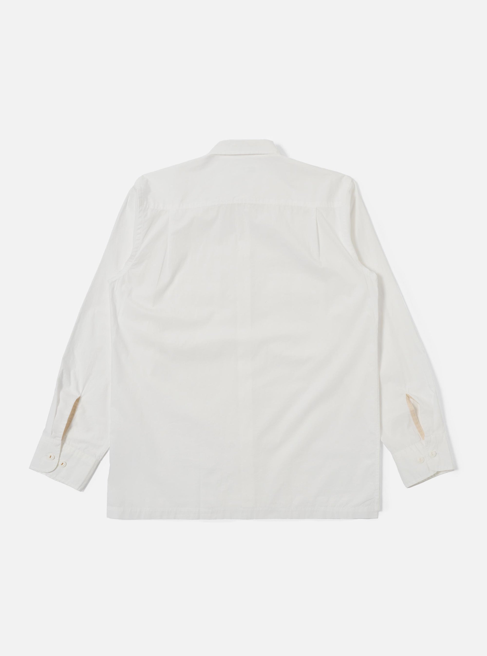 The Ecru Organic Fine Poplin CPO Shirt is shown from the back as a flat lay against a plain white background. The image highlights the clean construction of the garment's rear panel, featuring a two-piece collar and a straight hem. The fine organic cotton poplin fabric is a solid ecru color.