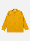 The Golden Brown Organic Fine Poplin CPO Shirt is shown as a flat lay against a white background. The shirt features two large button-down chest pockets, a classic pointed collar, and a central button-down closure. The fabric is a solid golden brown organic cotton poplin with a smooth finish.