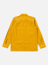 The Golden Brown Organic Fine Poplin CPO Shirt is shown from the back as a flat lay against a plain white background. The image highlights the shirt's smooth golden brown fabric, a straight hem, and a simple back yoke with a central box pleat.