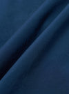 A close-up fabric swatch of the Navy Organic Fine Poplin CPO Shirt shows a deep navy blue color with a smooth, tightly woven poplin texture. The material is displayed in a way that highlights its fine grain and matte finish.