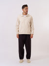 The Ecru Koko Cotlin Smock Overshirt is shown as a flat lay against a plain white background. The pullover-style garment features a wide spread collar, a partial button-down front, and two large patch pockets at the chest. The ecru-colored fabric is a blend of cotton and linen, showcasing a visible textured weave.