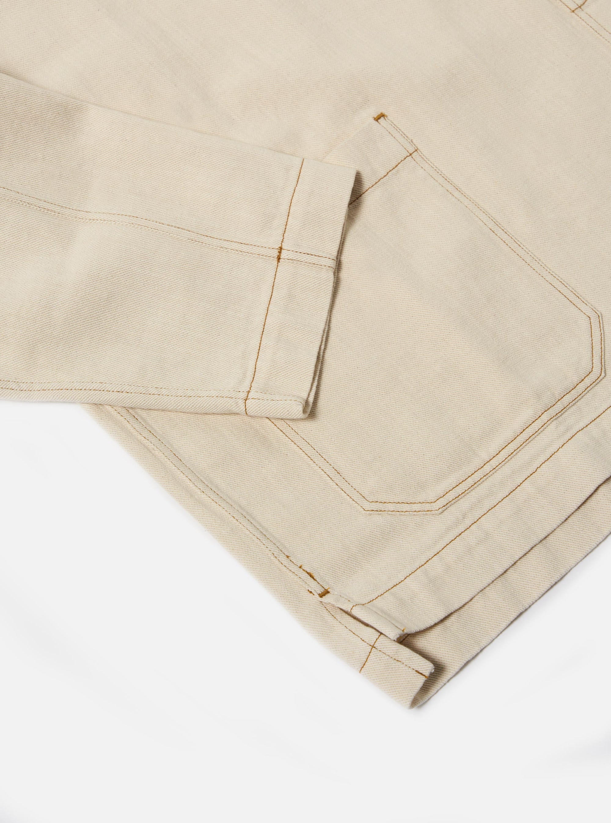 The Ecru Koko Cotlin Smock Overshirt is shown from the back as a flat lay against a plain white background. The image highlights the clean construction of the rear panel and the textured appearance of the ecru cotton-linen fabric.