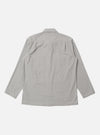 The Grey Izumi Cotton Dockside is shown from the back as a flat lay against a plain white background. The overshirt features a simple, straight-cut back panel with a horizontal yoke across the shoulders and a straight hem. The grey cotton fabric has a fine, smooth texture.