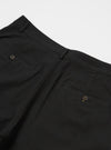 The Black Valencia Cotton Military Chino is shown from a rear angle as a flat lay against a plain white background. The image highlights the two rear patch pockets, one with a button-down flap, and the clean construction of the straight-leg design. The black fabric has a subtle, textured appearance.
