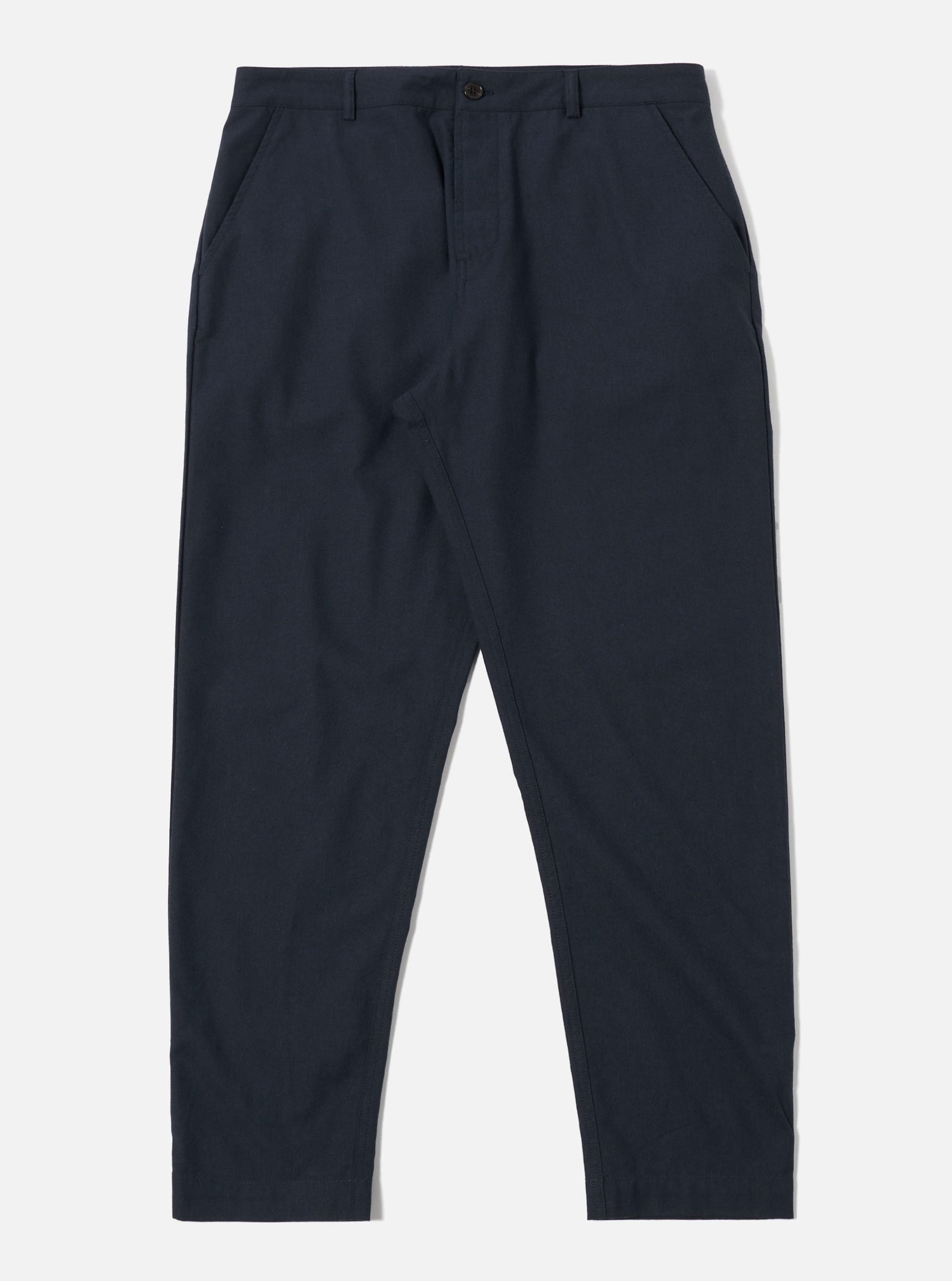 The Navy Valencia Cotton Military Chino is shown as a flat lay against a plain white background. The trousers feature a straight-leg cut, a button fly, and two large front patch pockets characteristic of military styling. The fabric is a dark navy textured cotton blend with visible stitching details.