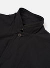 The Black Merida Seersucker Three Button Jacket is shown from the back as a flat lay against a plain white background. The image highlights the jacket's unstructured design, a central vertical seam, and the puckered texture of the black seersucker fabric.