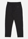 The Black Merida Seersucker Military Chino is shown from the back as a flat lay against a plain white background. The image highlights the two buttoned flap back pockets and the continuous Hollywood-style waistband. The black cotton fabric has a visible puckered seersucker texture.