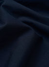 The Navy Classic Oxford Tropicana Shirt is presented as a flat lay against a plain white background. The shirt features a classic button-down front, a pointed collar, and a single patch pocket on the left chest. The deep navy blue fabric shows a visible Oxford weave texture.