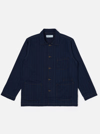 The Indigo Recycled Herringbone Bakers Overshirt is shown as a flat lay against a plain white background. The overshirt features a one-piece collar, a central button-down front, and four front patch pockets: one asymmetric pocket at the chest and three lower pockets including a small coin pocket. The indigo-dyed fabric displays a visible herringbone weave texture throughout.