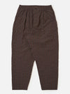 The Brown Chester Stripe Pleated Track Pant is shown as a flat lay against a white background. The trousers feature an elasticated waistband with an adjustable drawstring, a single pleat at the front, and a loose, tapered leg. The cotton seersucker fabric displays a subtle vertical pinstripe pattern in brown.