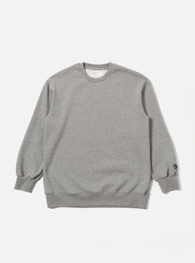 The Grey Marl Recycled Cotton Blend Jersey Loose Sweatshirt is shown as a flat lay against a plain white background. The sweatshirt features a crew neckline, long sleeves with dropped shoulders, and ribbed trim at the collar, cuffs, and hem. The fabric has a light grey marl texture.
