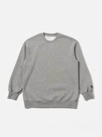 The Grey Marl Recycled Cotton Blend Jersey Loose Sweatshirt is shown as a flat lay against a plain white background. The sweatshirt features a crew neckline, long sleeves with dropped shoulders, and ribbed trim at the collar, cuffs, and hem. The fabric has a light grey marl texture.