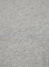 The Grey Marl Recycled Cotton Blend Jersey Loose Sweatshirt is shown from the back as a flat lay against a plain white background. The image highlights the sweatshirt's relaxed, loose fit, its simple crew neck, and the ribbed cuffs and hem. The fabric has a classic grey marl texture.