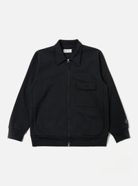 The Black Recycled Cotton Blend Jersey Tyler Jacket is shown as a flat lay against a plain white background. The jacket features a full-zip front, a classic pointed collar, and two large patch pockets at the waist. The sleeve cuffs and hem are finished with a simple, clean stitch, and the black jersey fabric has a smooth, soft texture.