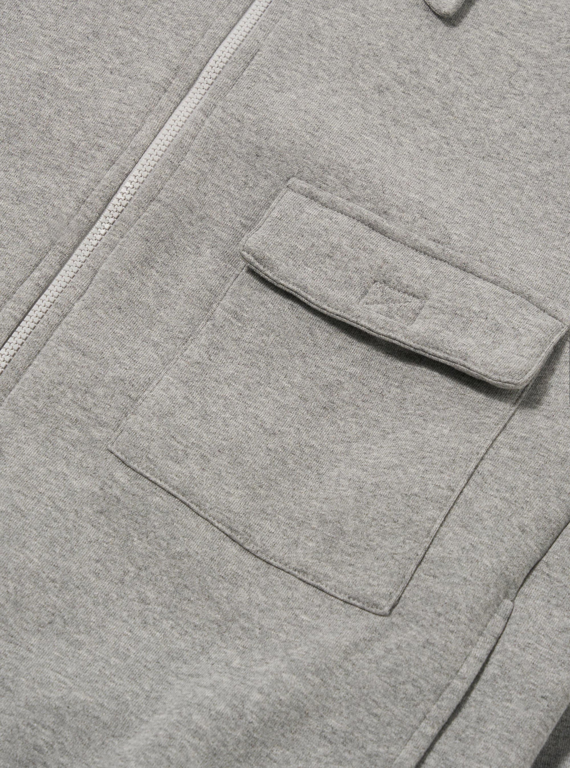 The Grey Marl Recycled Cotton Blend Jersey Tyler Jacket is shown from the back as a flat lay against a plain white background. The image highlights the jacket's simple rear construction, the soft grey marl texture of the jersey fabric, and the ribbed hem and cuffs.