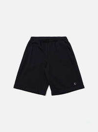 The Black Recycled Cotton Blend Jersey Vacation Short is shown as a flat lay against a plain white background. The shorts feature an elasticated waistband with a matching drawstring and two large patch pockets on the front. The black jersey fabric has a soft, matte finish.