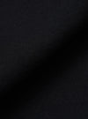 A close-up swatch image of the Black Recycled Cotton Blend Jersey Vacation Short fabric highlights the soft, matte texture of the black jersey knit material. The image provides a detailed view of the fabric's composition and consistent dark color.