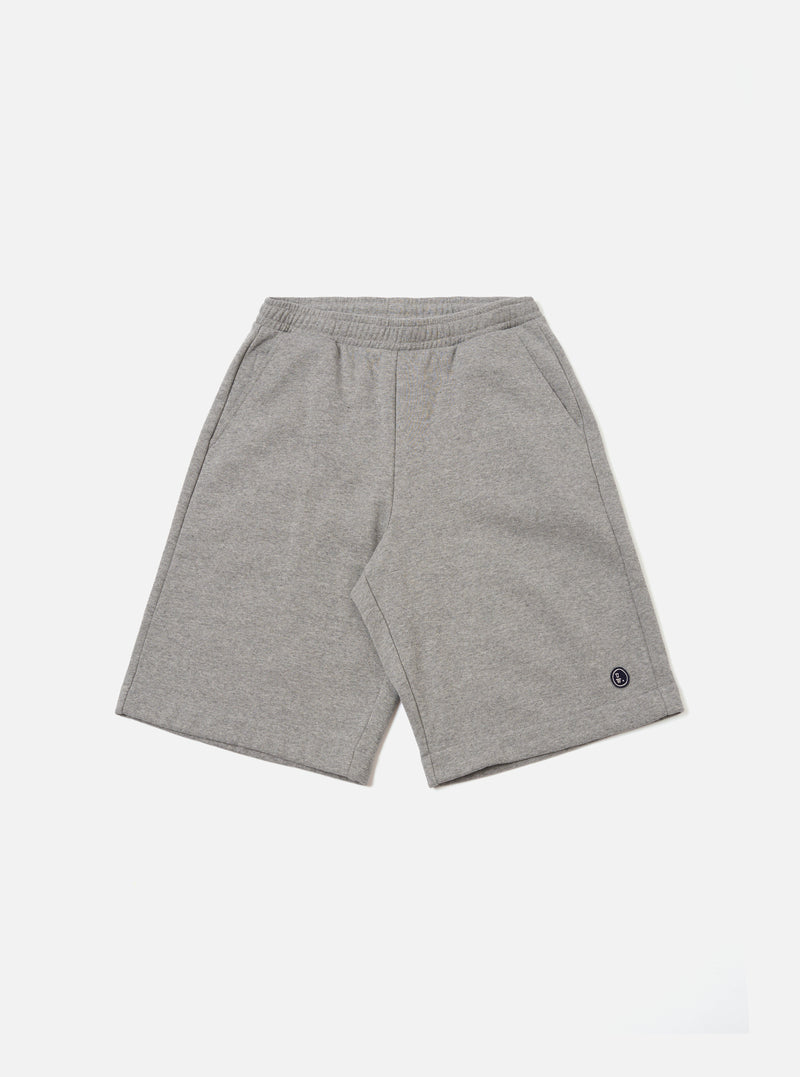 The Grey Marl Recycled Cotton Blend Jersey Vacation Short is presented as a flat lay against a plain white background. These shorts feature an elasticated waistband with a tonal drawstring, two side pockets, and a relaxed fit. The fabric is a soft, grey marl recycled cotton blend jersey with a visible speckled texture.