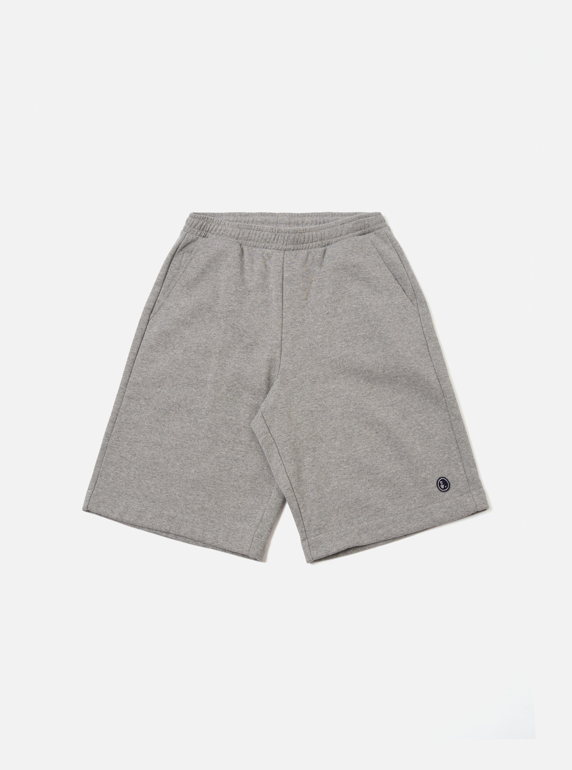 The Grey Marl Recycled Cotton Blend Jersey Vacation Short is presented as a flat lay against a plain white background. These shorts feature an elasticated waistband with a tonal drawstring, two side pockets, and a relaxed fit. The fabric is a soft, grey marl recycled cotton blend jersey with a visible speckled texture.