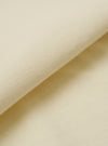 A close-up swatch image of the Ecru Piquet Vacation Polo fabric highlights the intricate honey-comb piquet texture. The fabric is a solid ecru color, and the image focuses entirely on the material's knit pattern and soft appearance.