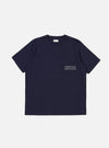 The Bright Navy Organic Jersey Print Pocket Tee is shown as a flat lay against a plain white background. The T-shirt features a crew neck, short sleeves, and a single patch pocket on the left chest with a contrasting graphic print. The garment is made from a solid bright navy blue organic cotton jersey.