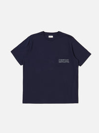 The Bright Navy Organic Jersey Print Pocket Tee is shown as a flat lay against a plain white background. The T-shirt features a crew neck, short sleeves, and a single patch pocket on the left chest with a contrasting graphic print. The garment is made from a solid bright navy blue organic cotton jersey.