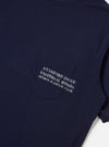 The Bright Navy Organic Jersey Print Pocket Tee is shown from the back as a flat lay against a plain white background. The short-sleeved t-shirt features a ribbed crew neckline and a straight hem. The garment is made from a solid bright navy organic cotton jersey fabric.