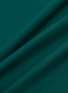 A close-up fabric swatch of the Olive Organic Jersey Print Pocket Tee displays the olive green color and soft, fine-knit texture of the organic cotton jersey material. The fabric is shown in detail, highlighting its consistent matte finish and weave.