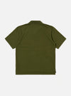 The Olive Rugby Jersey Oversized Vacation Polo is shown from the back as a flat lay against a plain white background. The image highlights the oversized silhouette, the back of the one-piece collar, and the stepped hem with a dropped back. Small side vents are visible at the bottom of the side seams.