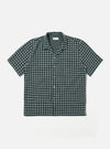 The Green/White Rhodes 8 Cotton Road Shirt is shown as a flat lay against a white background. The shirt features an all-over vertical stripe pattern in green and white, a camp collar, a central button-down closure, and two large chest patch pockets. The fabric has a visible textured weave.